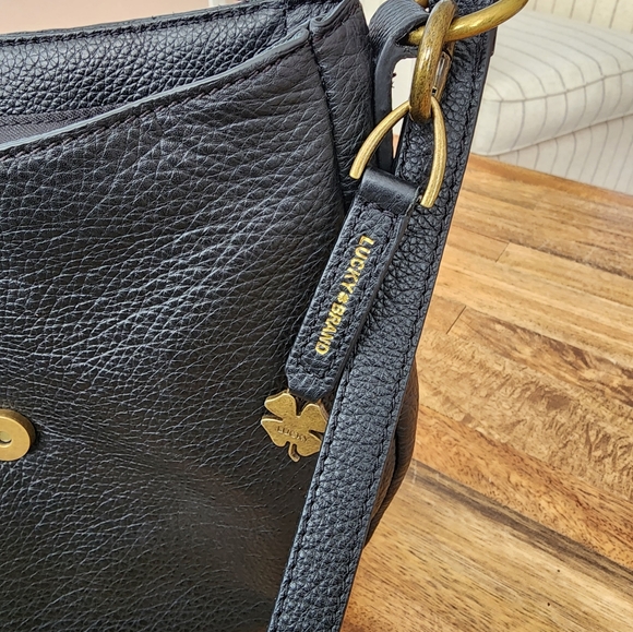 Lucky Brand black leather purse with magnetic tassle closure. It is 10"x10". - Picture 4 of 7